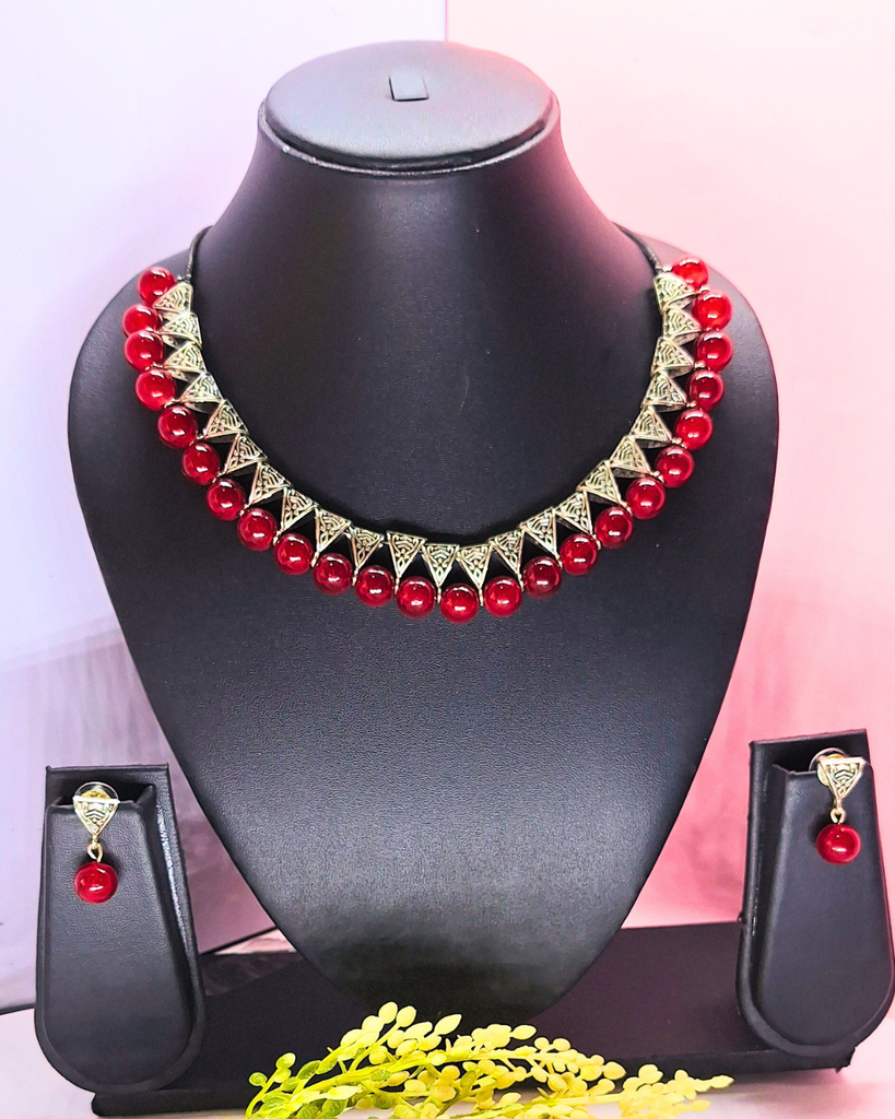 maroon bead with antique charms