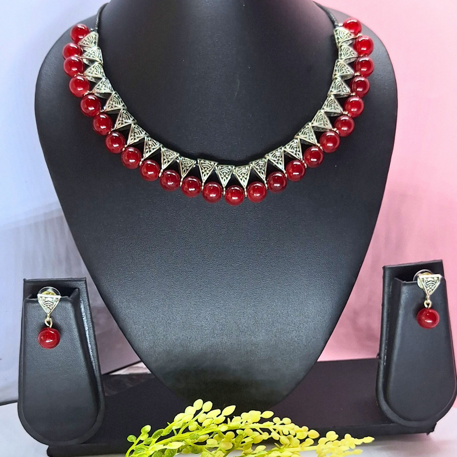 maroon bead with antique charms