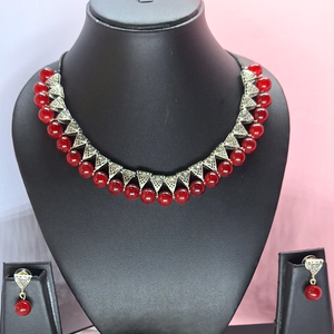 maroon bead with antique charms