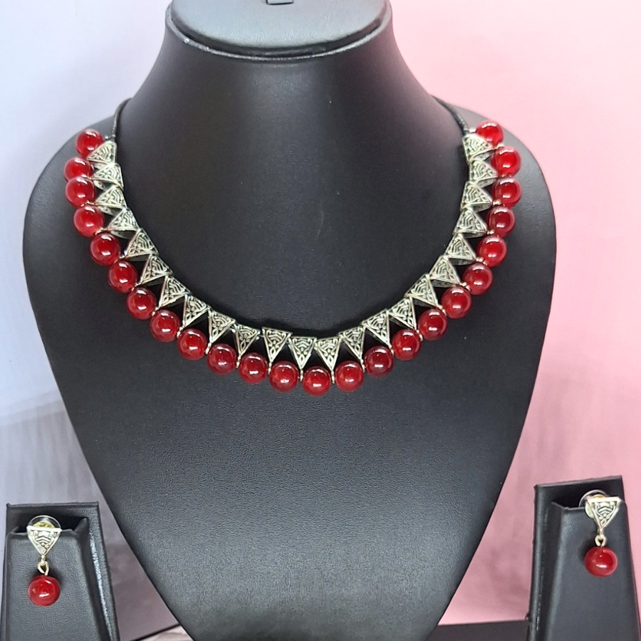 maroon bead with antique charms